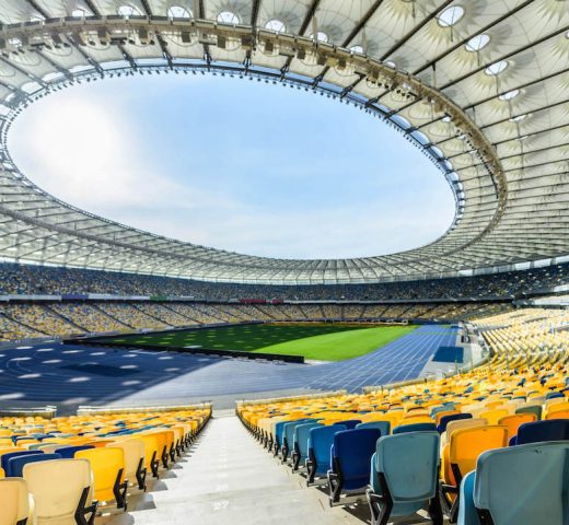 rows-of-yellow-and-blue-stadium-seats-on-soccer-fi-2021-08-29-10-48-54-utc-1.jpg